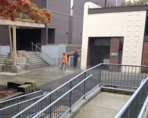Technicians Pressure Washing Campus Grounds